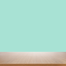 Image of Empty wooden surface on mint background. Mockup for design