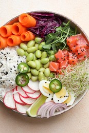 Photo of Delicious poke bowl with quail eggs, fish and edamame beans on light table, top view
