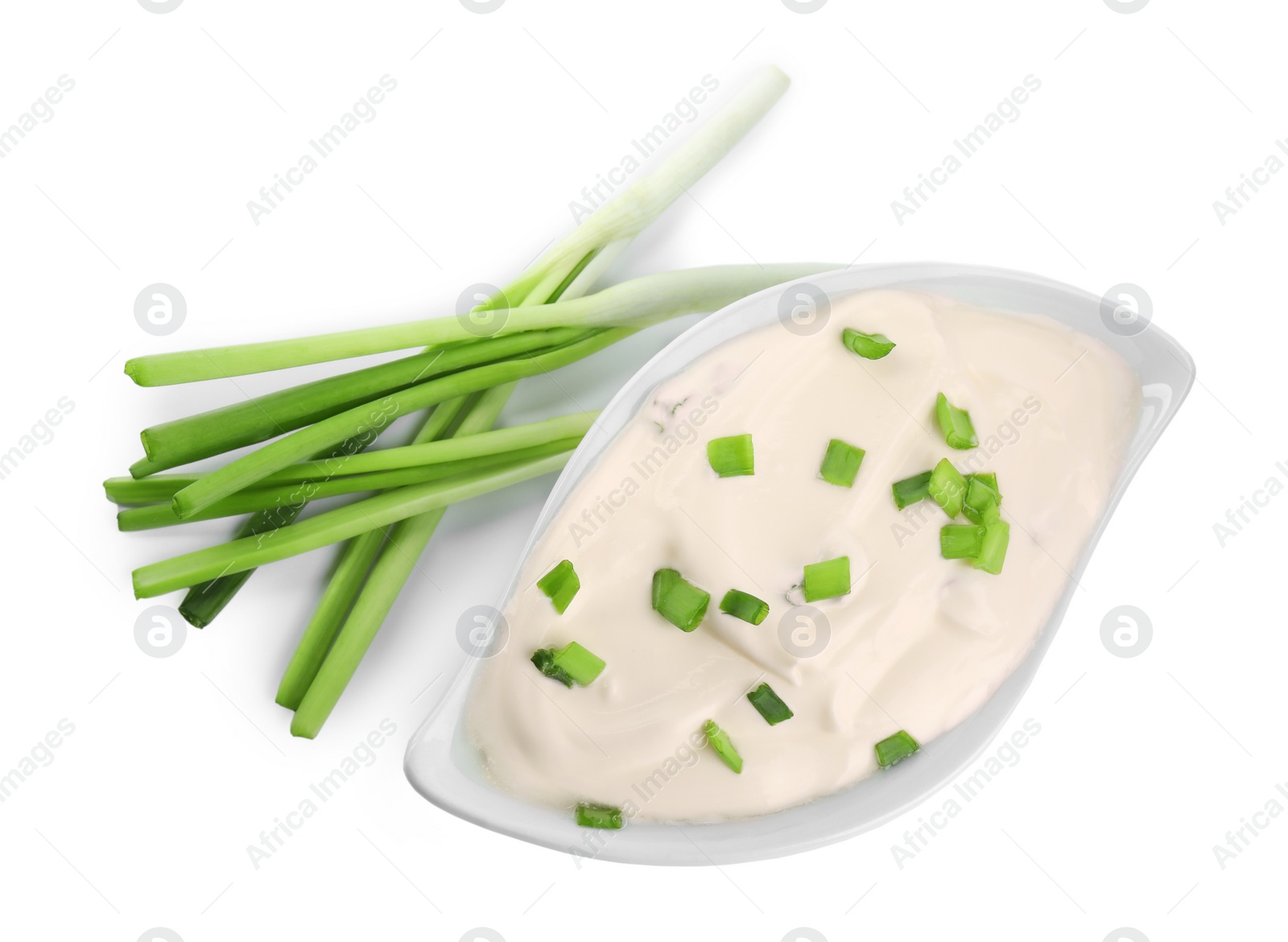 Photo of Fresh sour cream with onion on white background