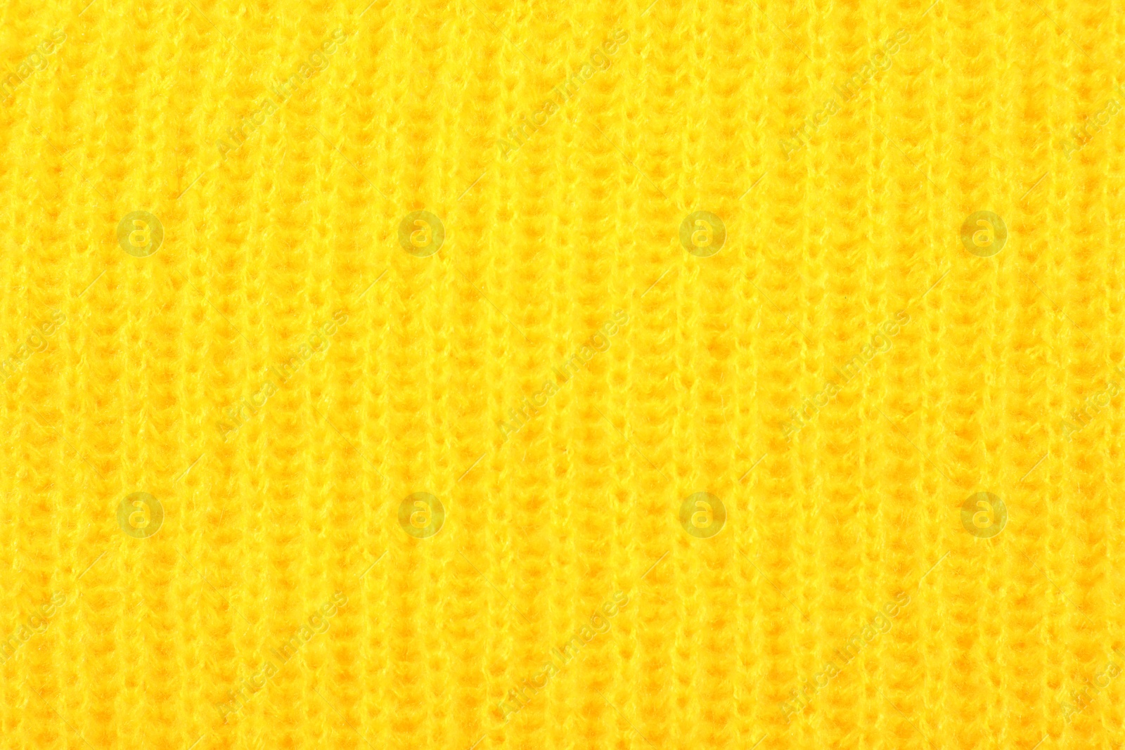 Photo of Texture of cozy warm sweater as background, closeup