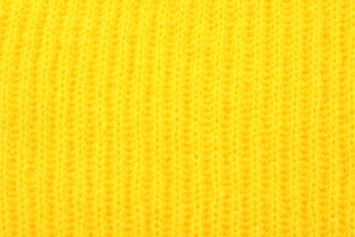 Texture of cozy warm sweater as background, closeup