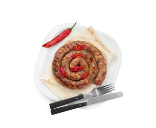 Photo of Delicious homemade sausage with chili pepper, lavash and cutlery isolated on white, top view