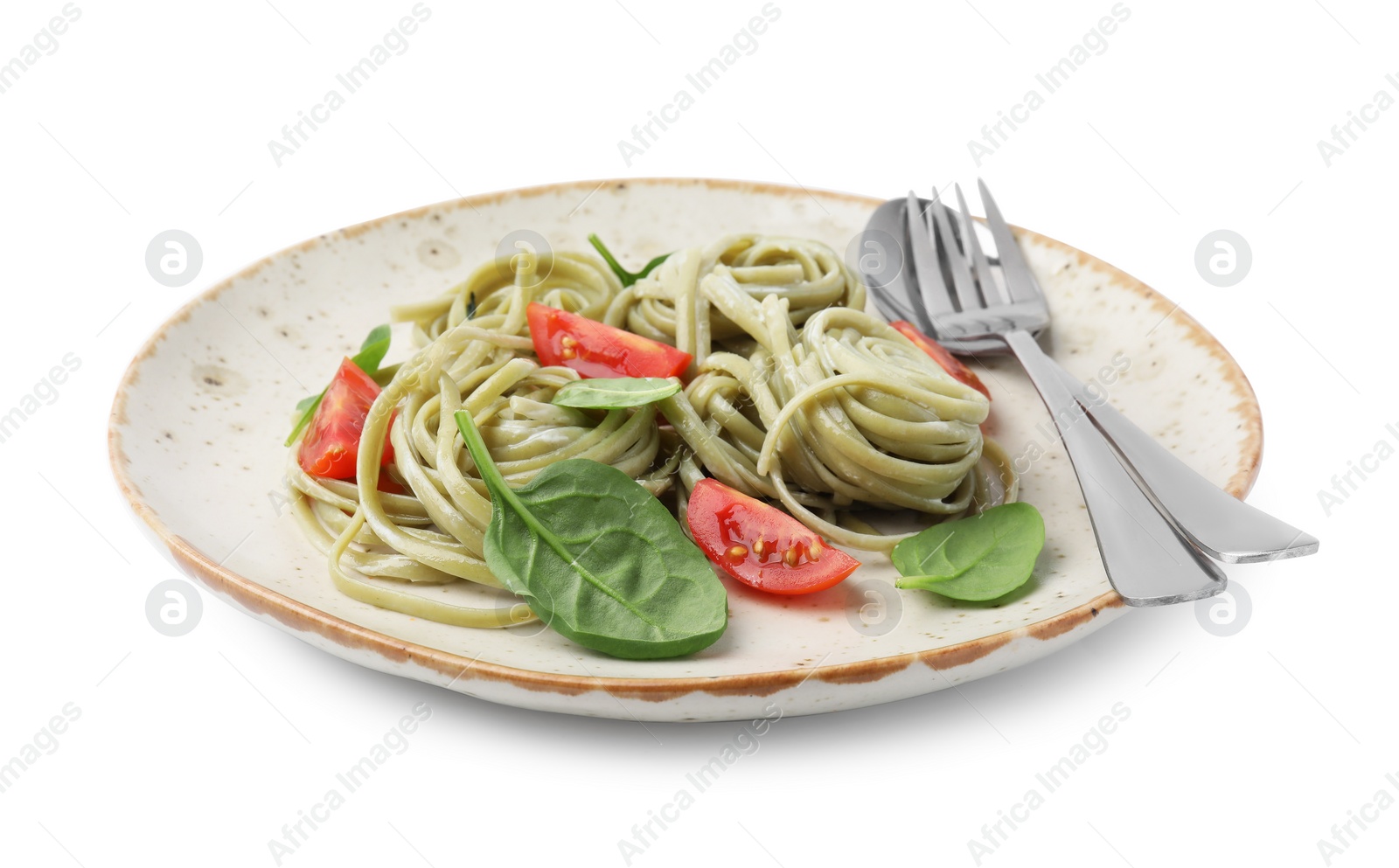 Photo of Tasty pasta with spinach, tomatoes and cutlery isolated on white