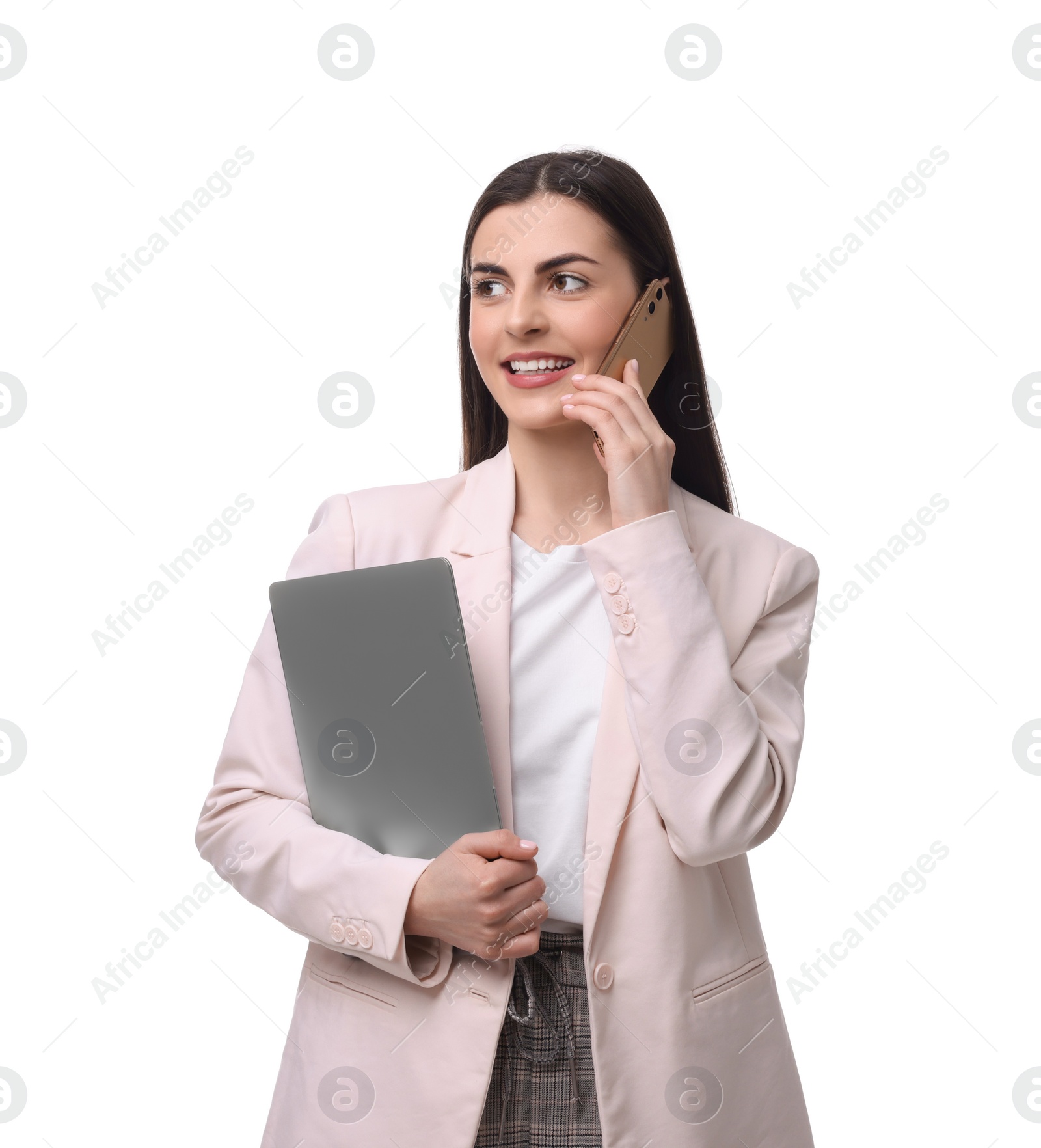 Photo of Beautiful businesswoman with laptop talking on smartphone against white background