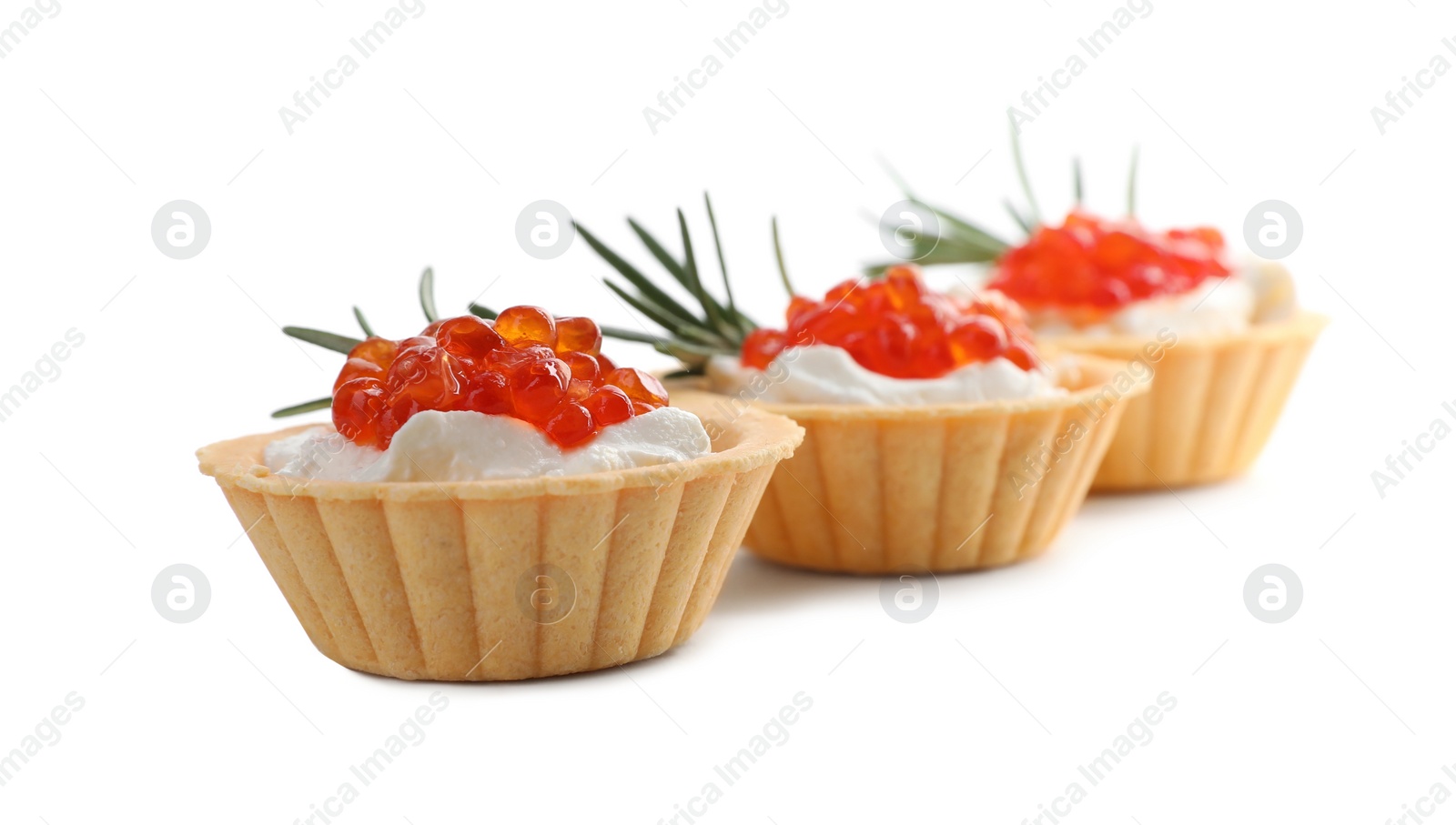 Photo of Delicious tartlets with red caviar and cream cheese on white background