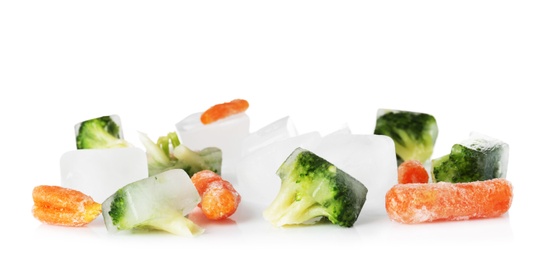 Photo of Frozen vegetables and ice cubes on white background