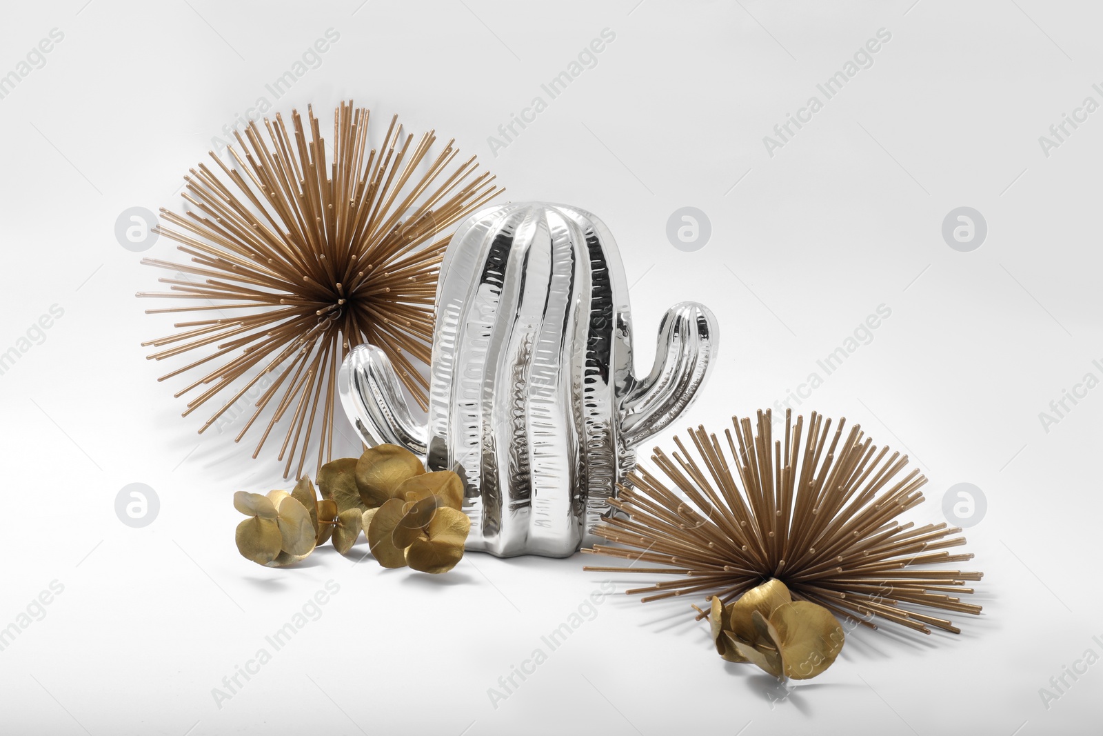 Photo of Different golden and silver decor elements isolated on white