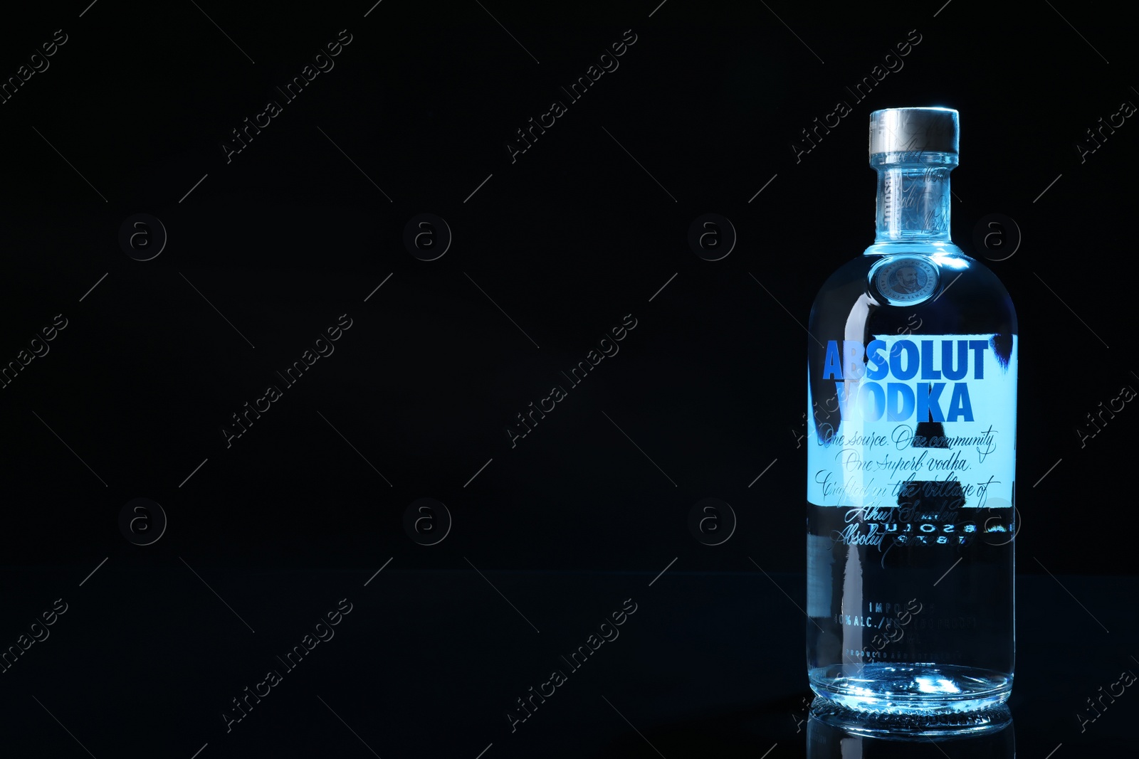 Photo of MYKOLAIV, UKRAINE - OCTOBER 04, 2019: Absolut vodka on black background. Space for text