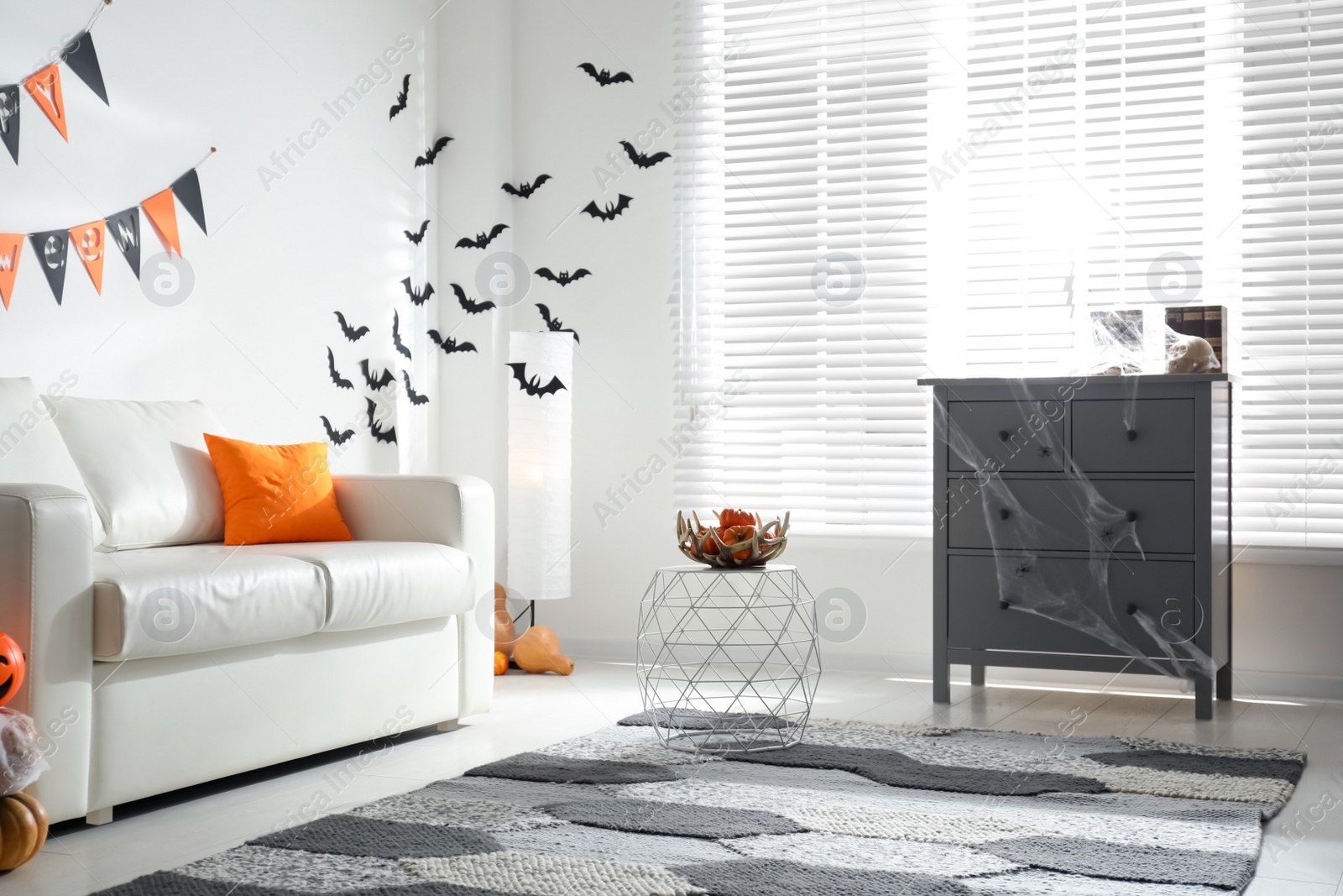 Photo of Modern room decorated for Halloween. Festive interior