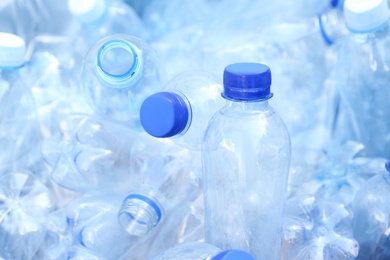 Photo of Pile of used plastic bottles as background, closeup. Recycling problem