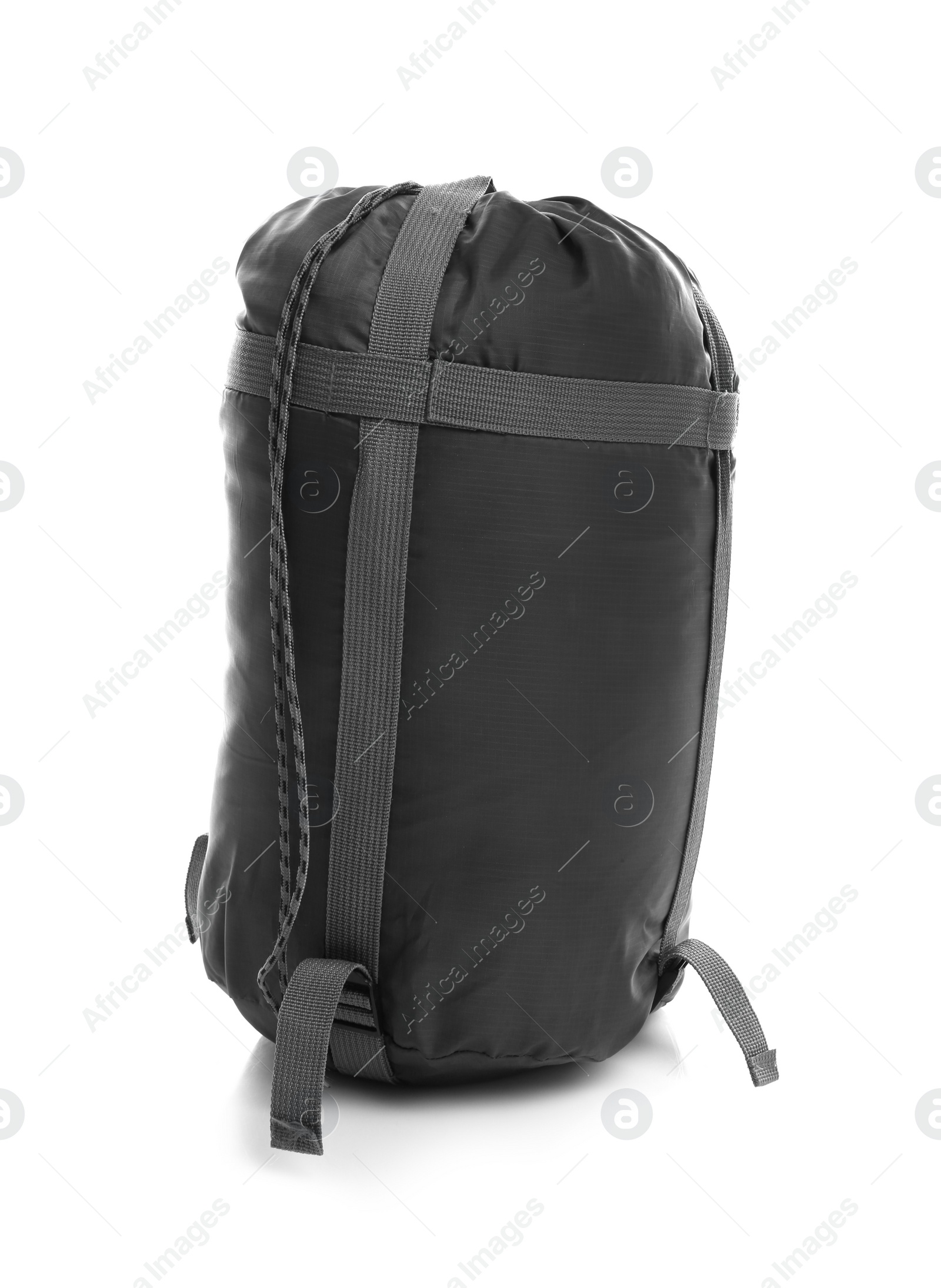 Photo of Sleeping bag in case on white background. Camping equipment