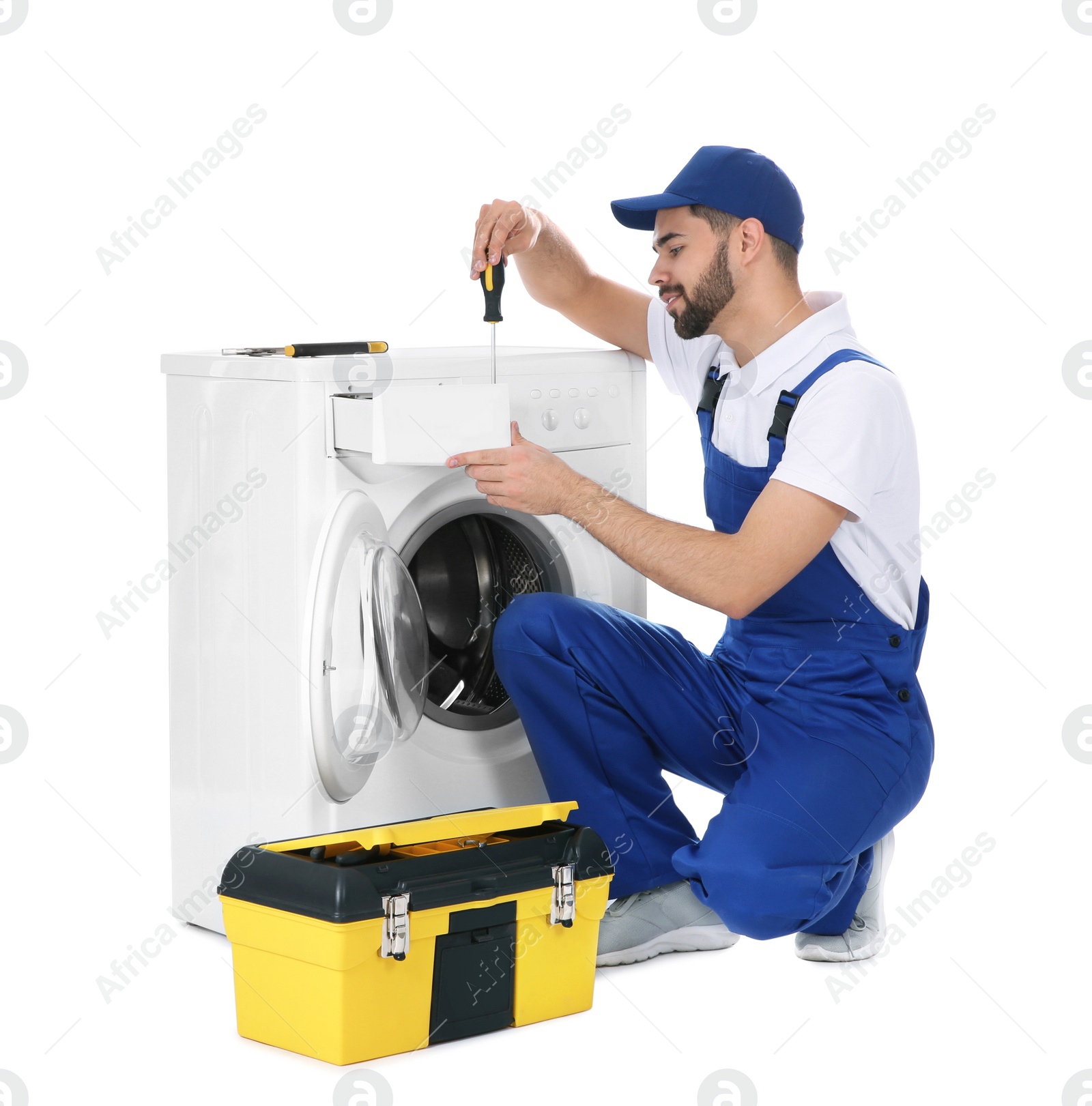Photo of Plumber repairing washing machine on white background