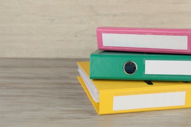 Photo of Stack of office folders on white wooden table, space for text