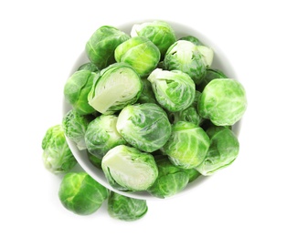 Photo of Fresh Brussels sprouts in bowl isolated on white, top view