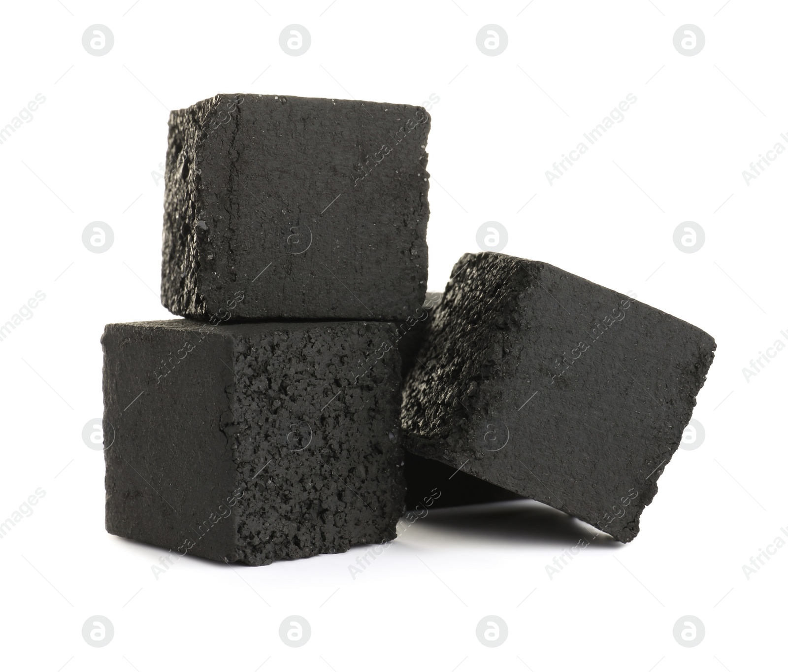 Photo of Stack of charcoal cubes for hookah on white background