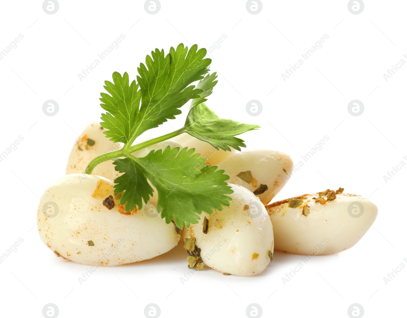 Photo of Preserved garlic with parsley on white background