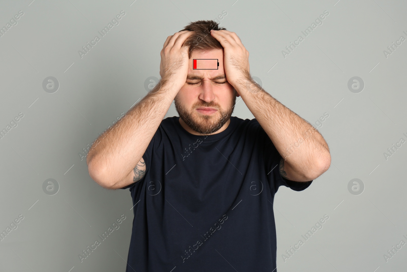 Image of Illustration of discharged battery and tired man on light grey background. Extreme fatigue