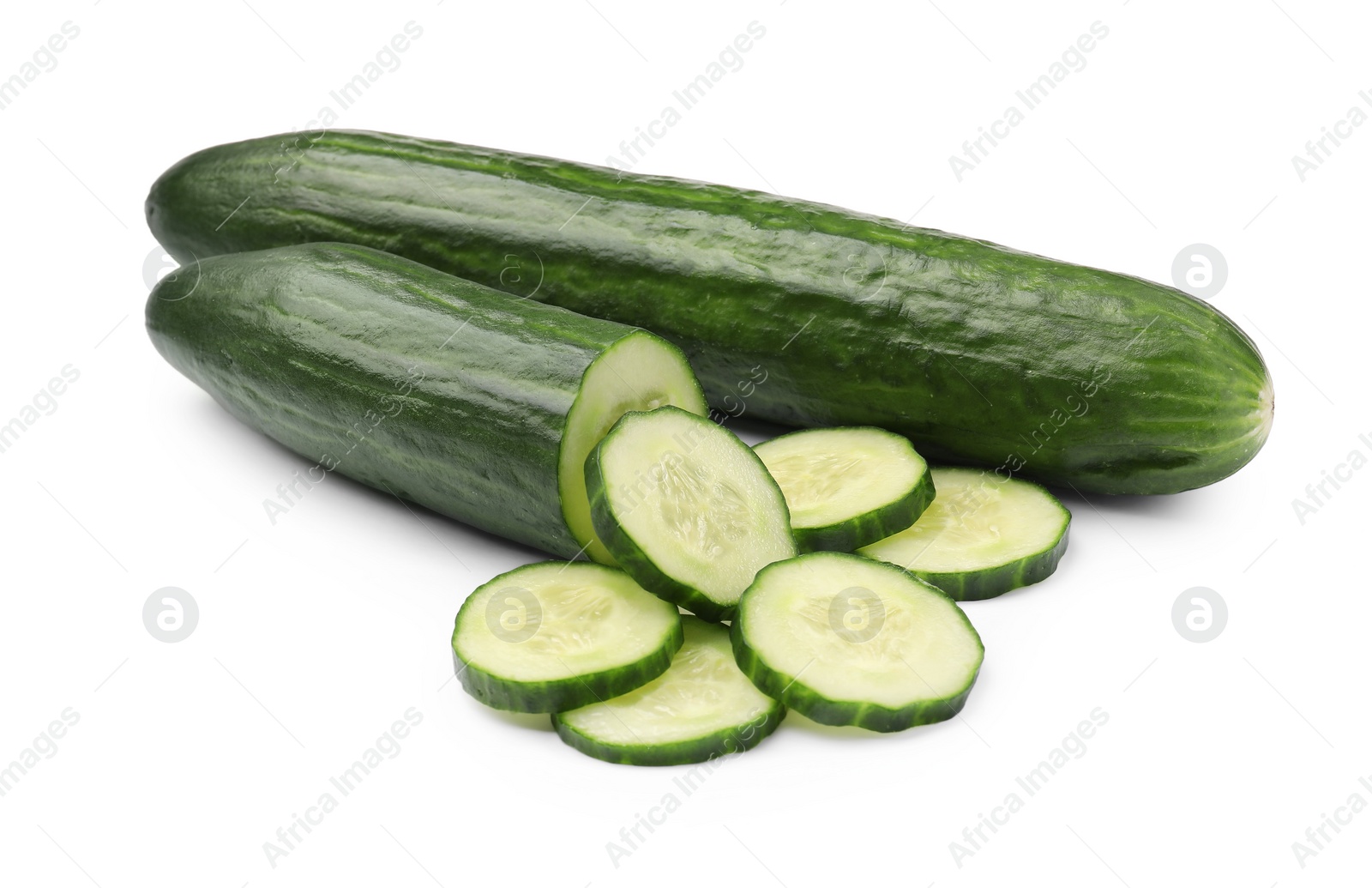 Photo of Whole and cut long cucumbers isolated on white