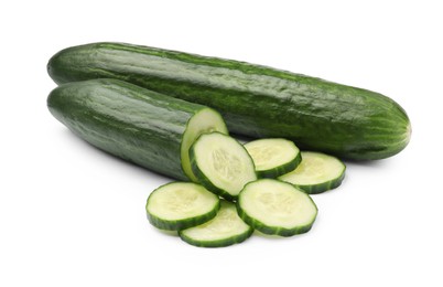 Photo of Whole and cut long cucumbers isolated on white