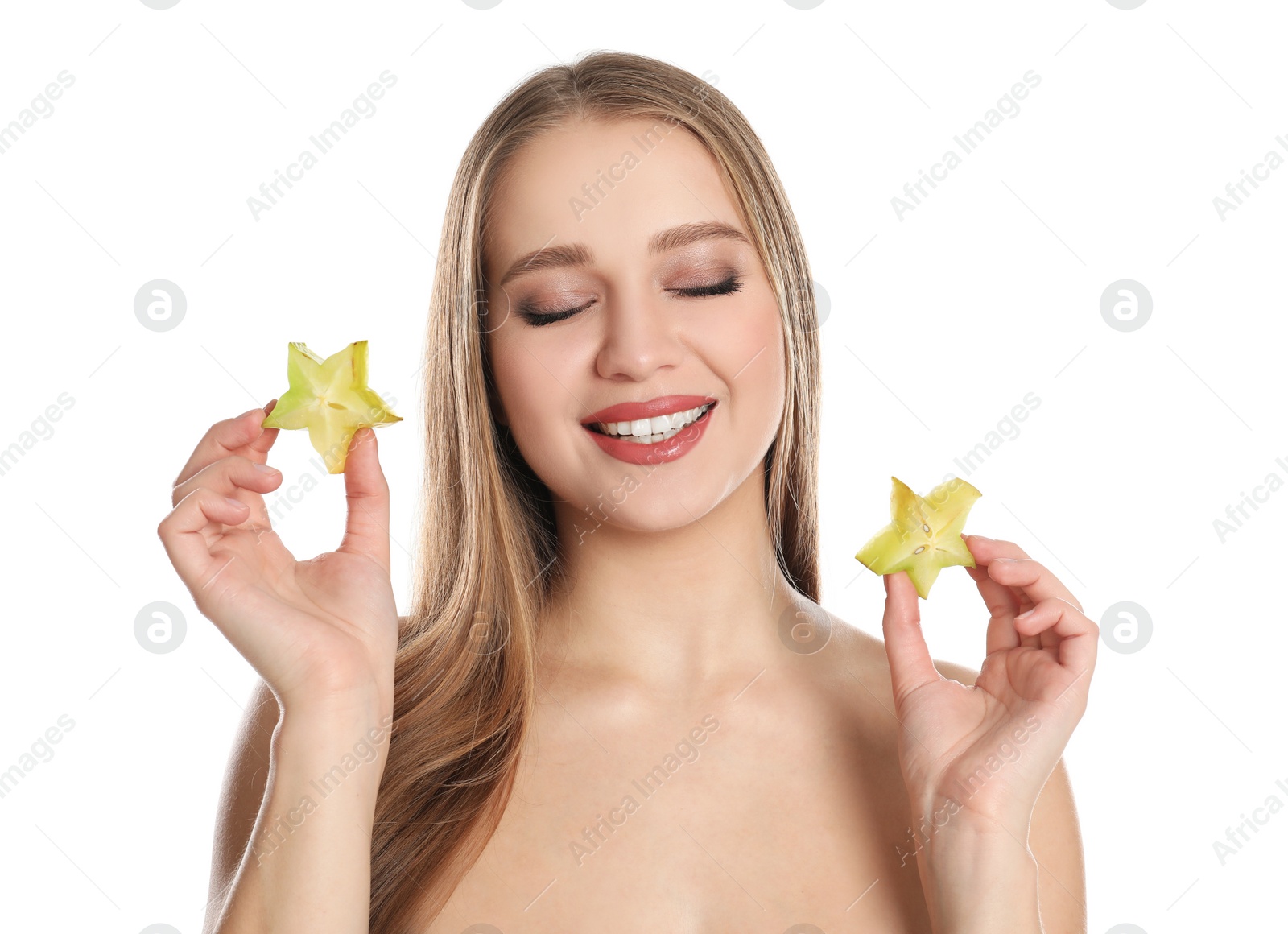 Photo of Young woman with cut carambola on white background. Vitamin rich food