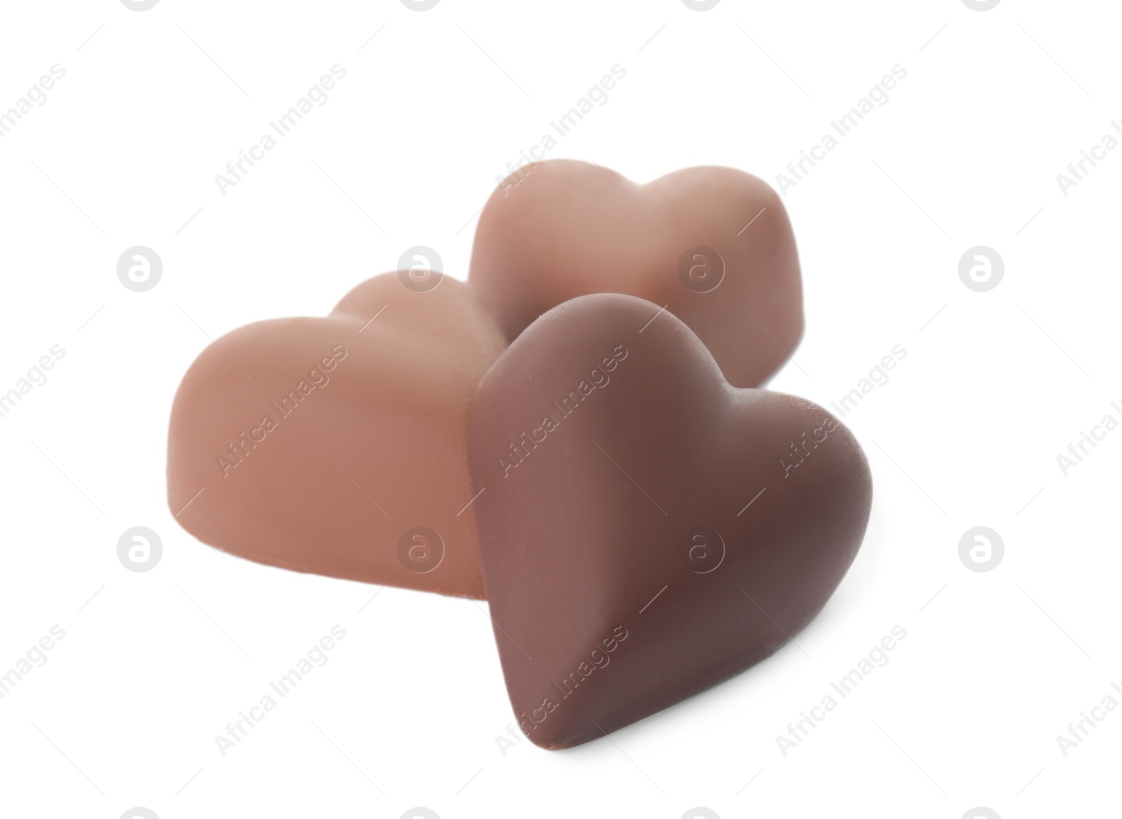 Photo of Tasty heart shaped chocolate candies on white background. Valentine's day celebration