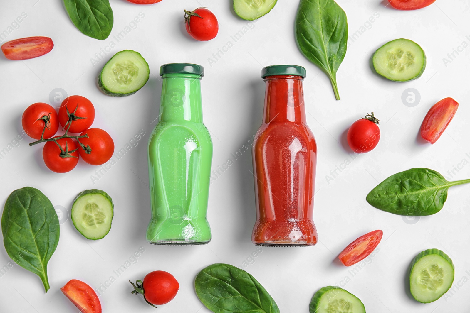 Photo of Flat lay composition with bottles of juices on white background