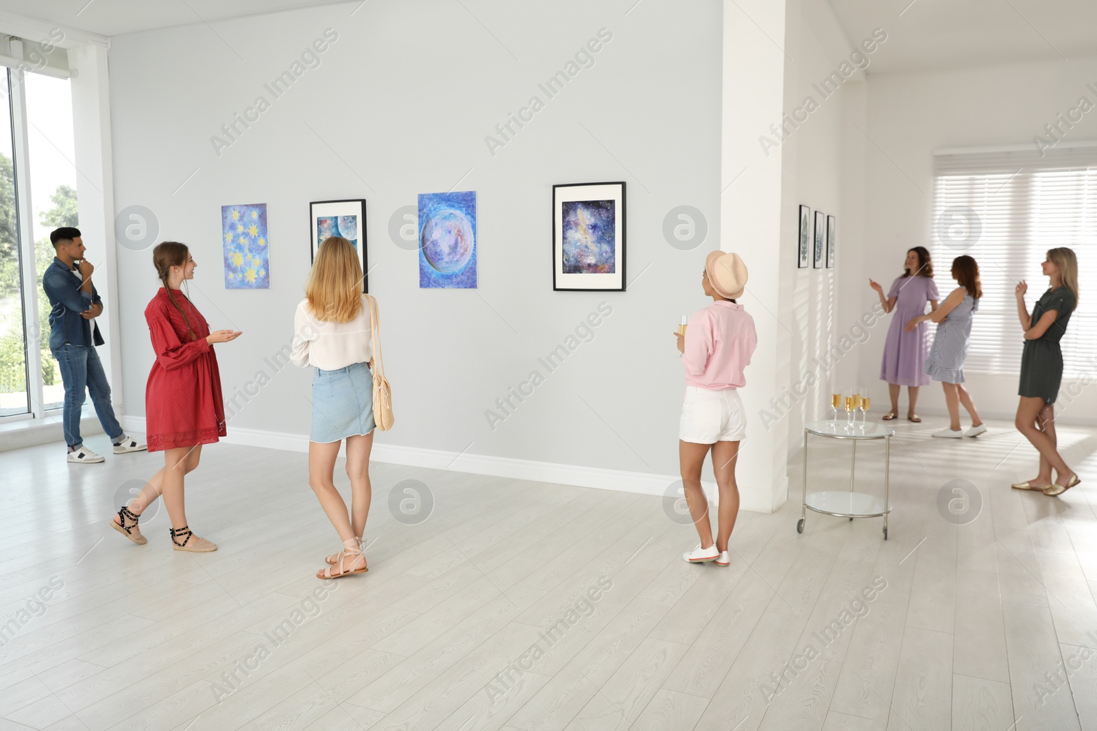 Photo of Group of people at exhibition in art gallery