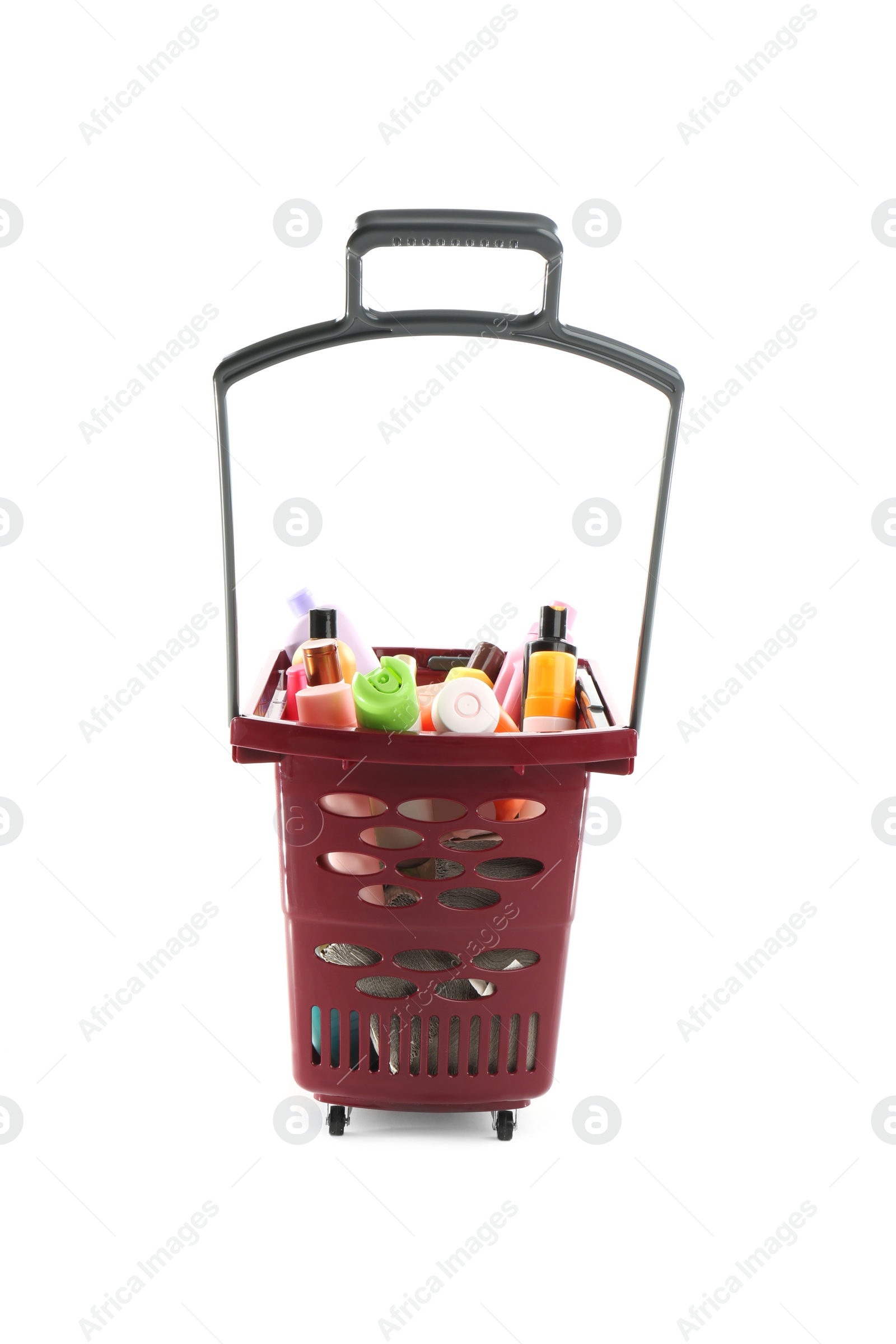 Photo of Shopping basket full of cleaning supplies isolated on white