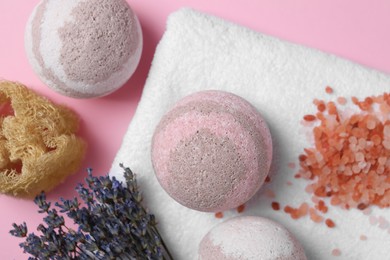 Photo of Flat lay composition with bath bombs on pink background
