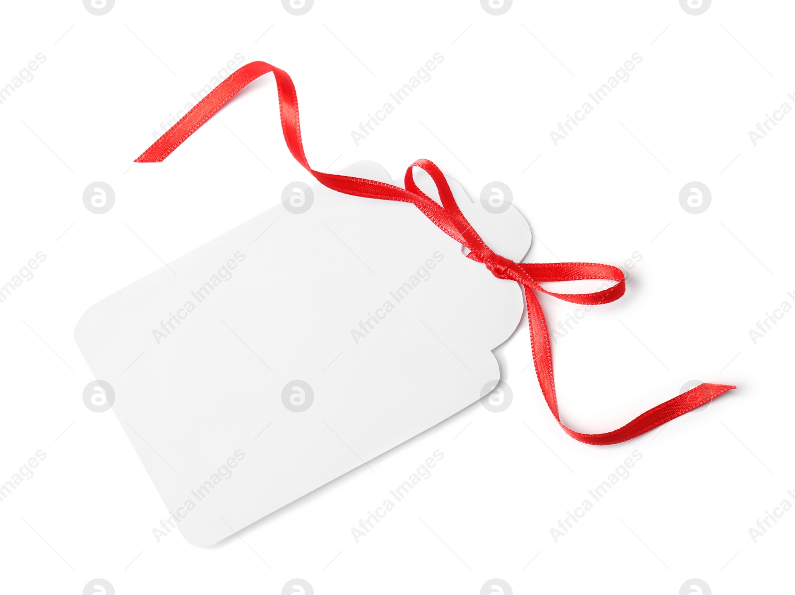 Photo of Blank gift tag with satin ribbon on white background, top view