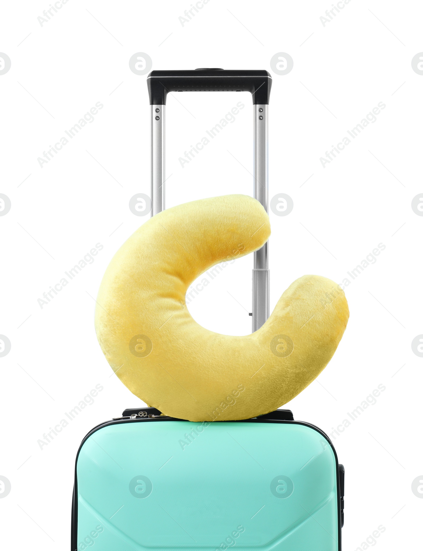 Photo of Soft travel pillow on turquoise suitcase isolated on white