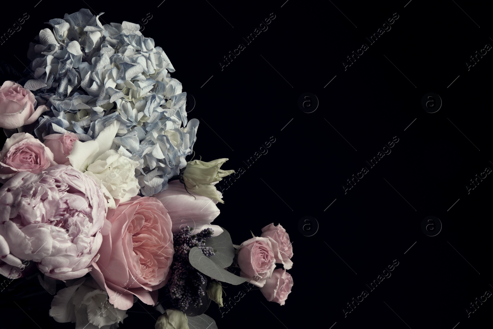 Photo of Beautiful bouquet of different flowers on black background, space for text. Floral card design with dark vintage effect