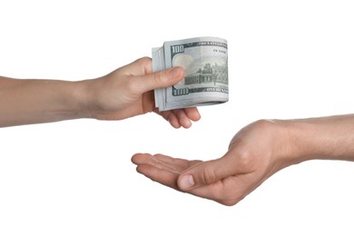 Photo of Money exchange. Man giving dollar banknotes to woman on white background, closeup