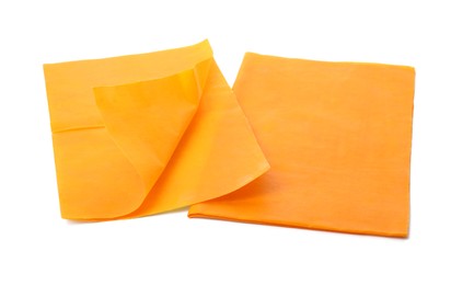 Photo of Orange reusable beeswax food wraps on white background