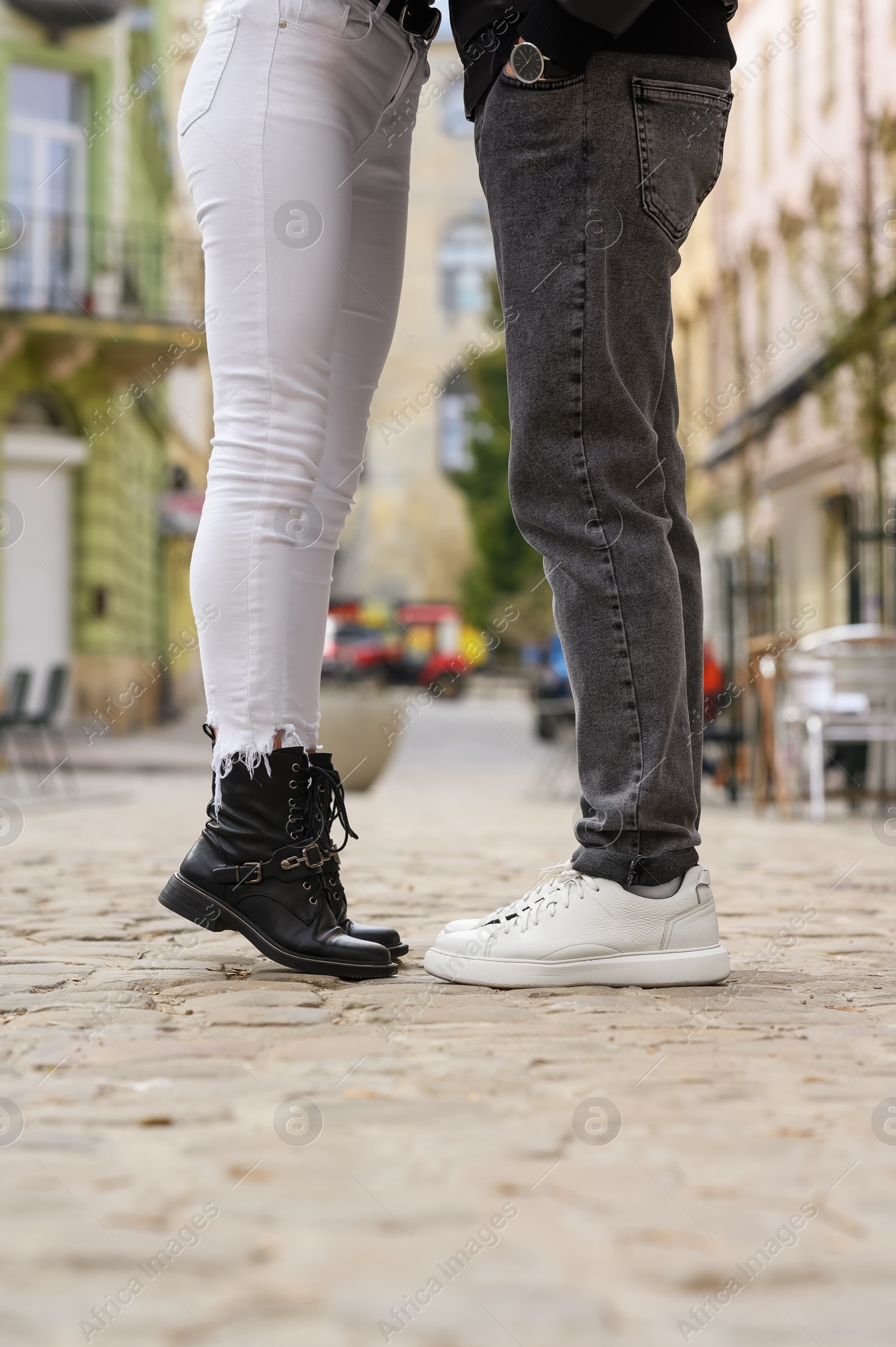 Photo of Lovely couple enjoying time together outdoors, closeup. Romantic date