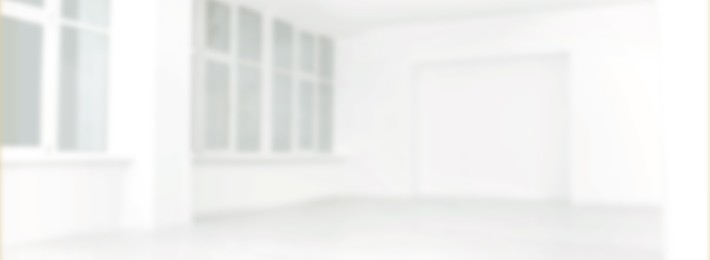 Empty room with white wall and windows, blurred view. Banner design