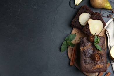 Photo of Flat lay composition with tasty pear bread on black table, space for text. Homemade cake