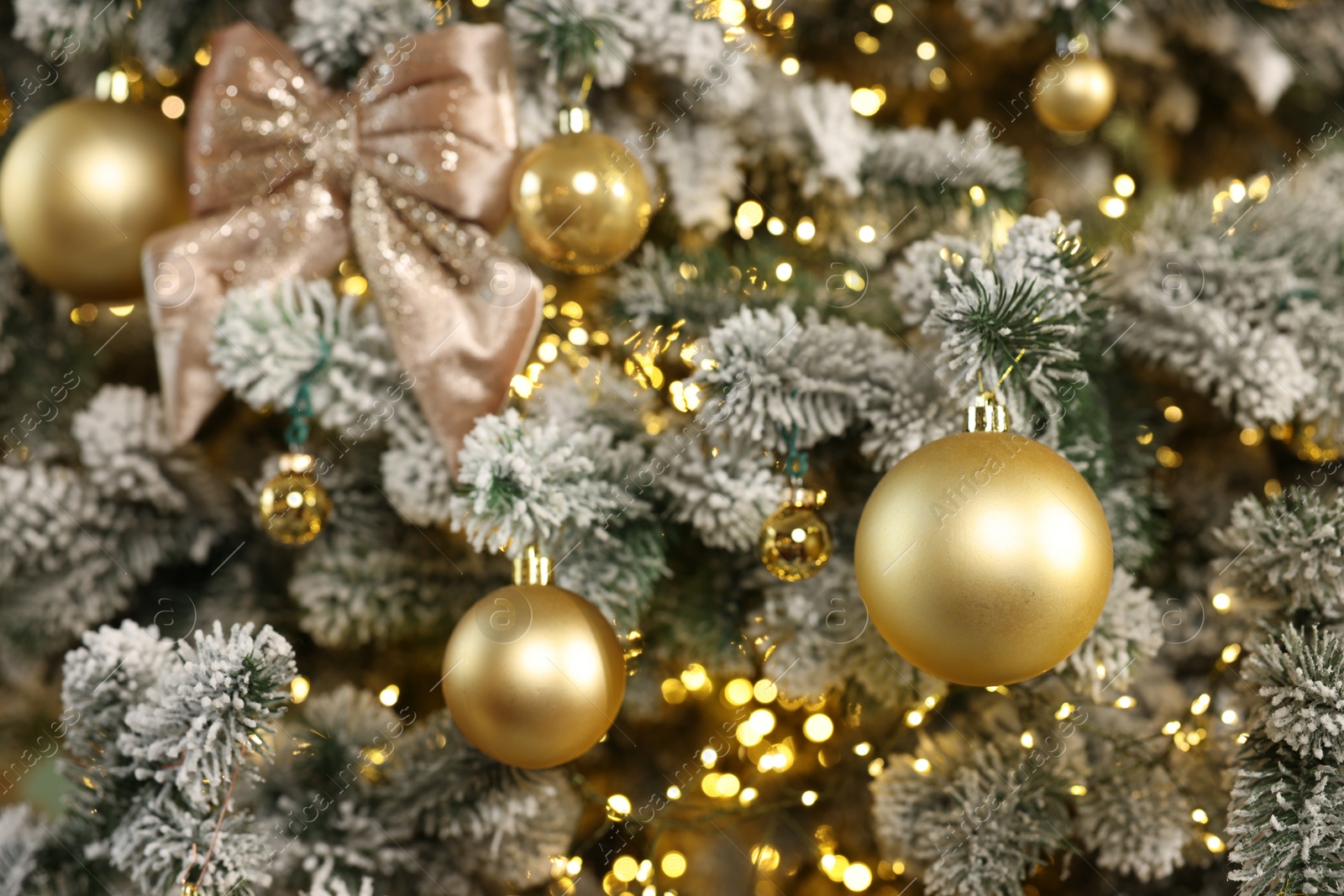 Photo of Beautiful decorated Christmas tree with baubles and lights as background, closeup