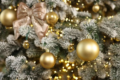 Photo of Beautiful decorated Christmas tree with baubles and lights as background, closeup