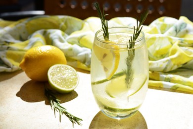 Tasty refreshing lemonade and ingredients on light table. Summer drink