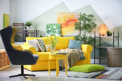 Photo of Stylish living room interior with comfortable sofa and armchair