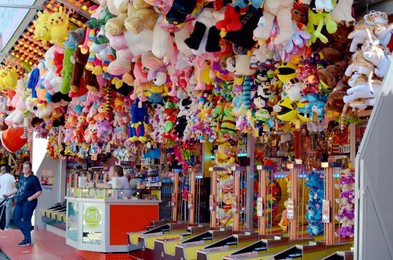 Netherlands, Groningen - May 18, 2022: Beautiful stall with different toys for winning in amusement park