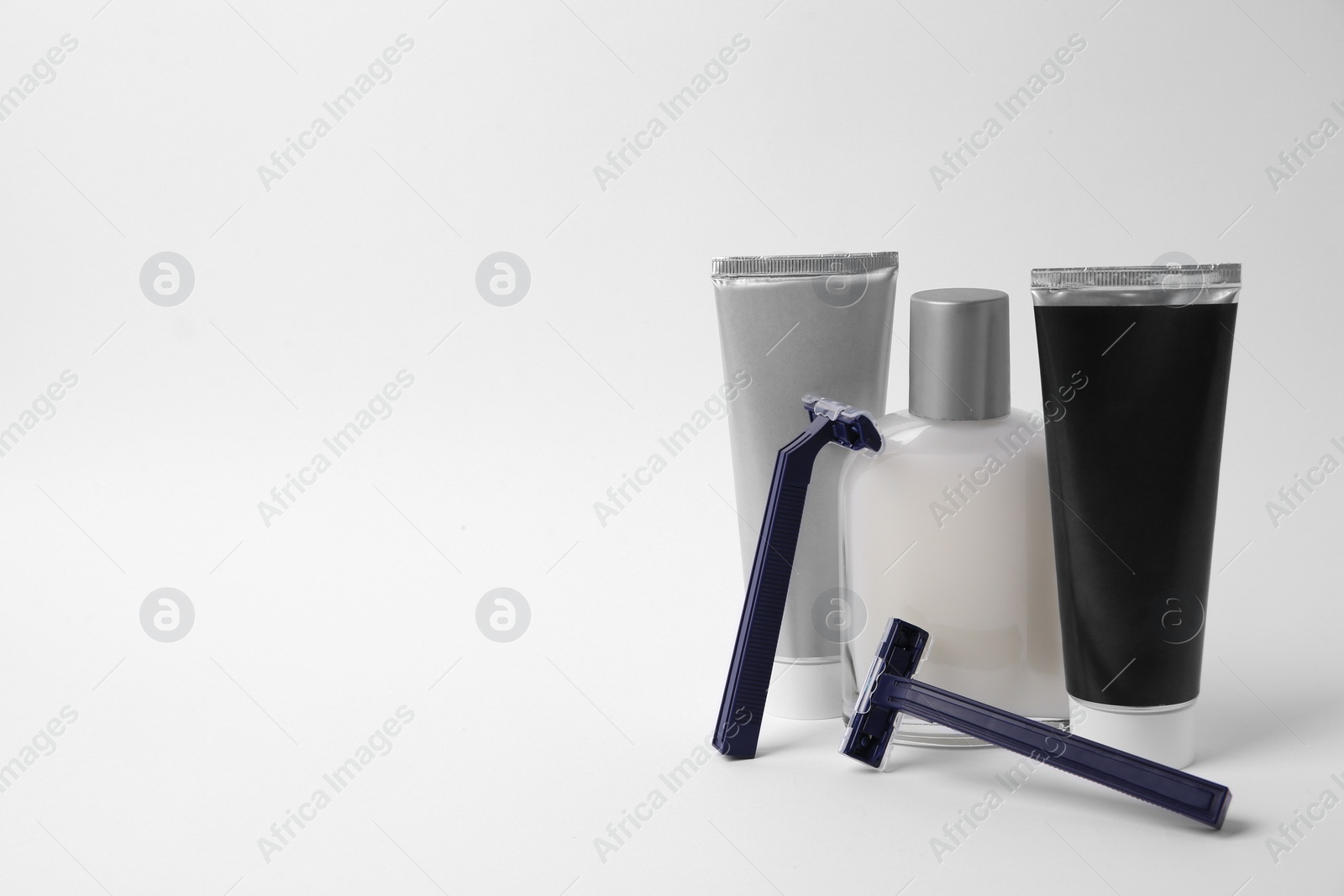 Photo of Different men's shaving accessories on white background. Space for text