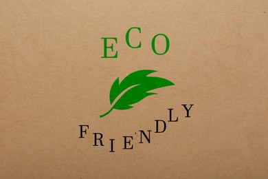 Image of Phrase Eco Friendly written on cardboard, top view