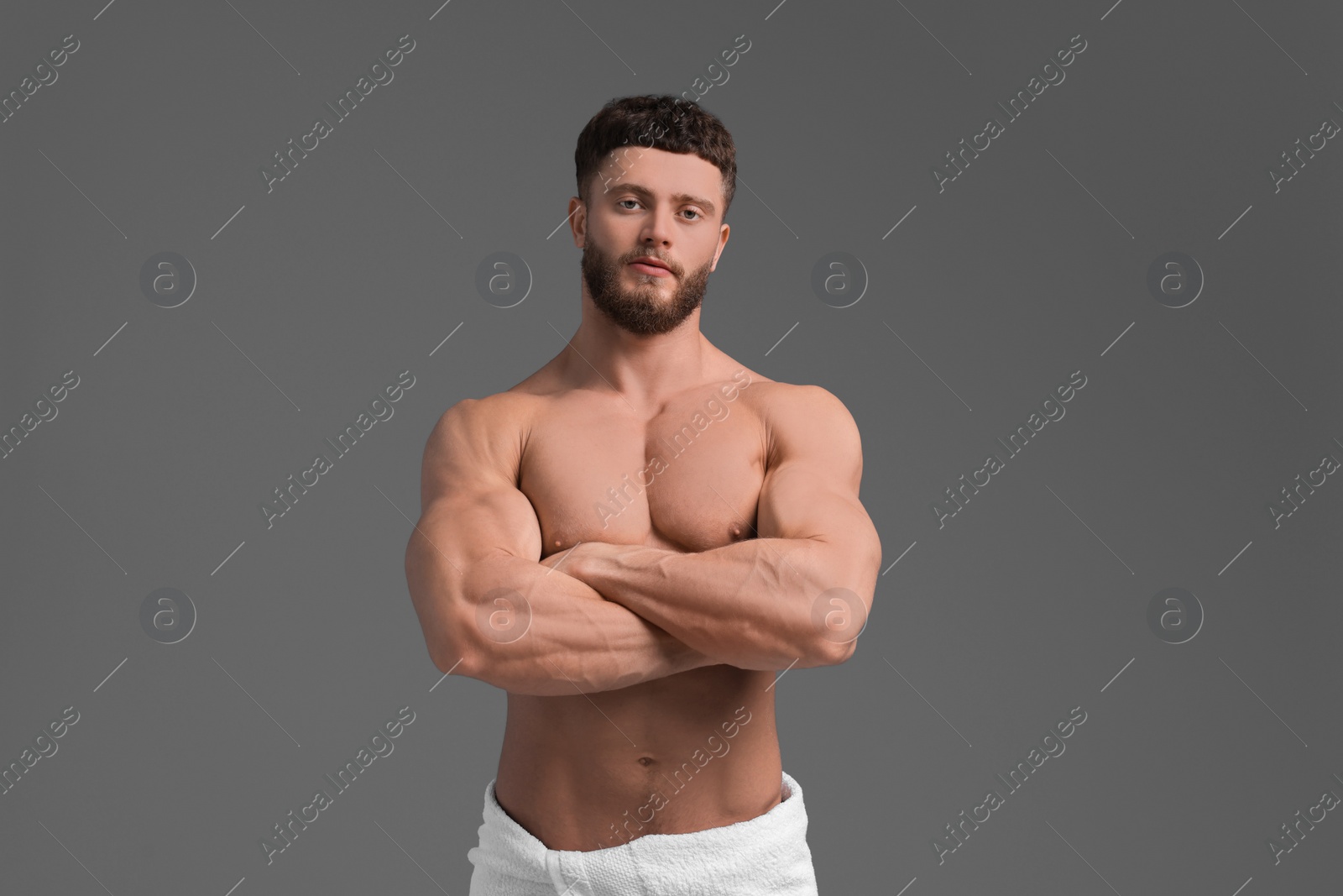 Photo of Handsome muscular man on grey background. Sexy body