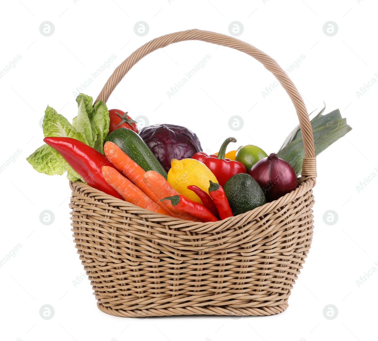 Photo of Fresh ripe vegetables and fruits in wicker basket on white background