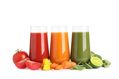 Different tasty juices and fresh ingredients on white background