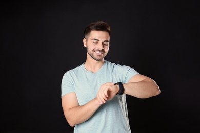 Photo of Portrait of handsome man on black background