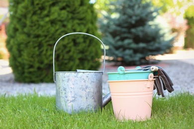 Set of gardening tools on green grass