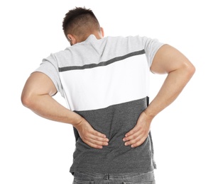 Man suffering from backache on white background